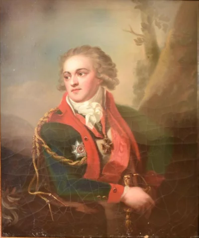 На шее, на красной ленте, Владимирский крест.